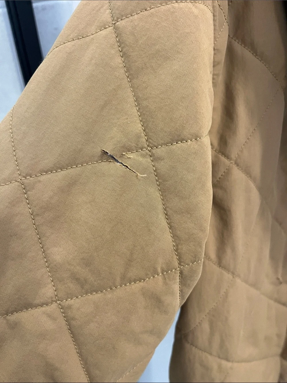 The North Face Quilted Sherpa-Lined Jacket in Camel